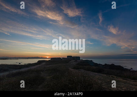 Sunset over Fort Hommet in Guernsey Stock Photo