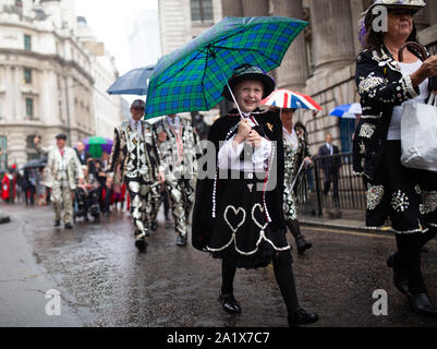 The Pearly Kings and Queens parade to St Mary-le-Bow church in London to celebrate the harvest festival. Stock Photo
