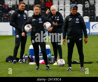 Boreham Wood, UK. 29th Sep, 2019. BOREHAMWOOD, ENGLAND - SEPTEMBER 29: L-R Strength & Conditioning Coach Ivo Nunez Miguel, Assistant manager Amy Merricks, Physiotherapist Lisa Walsh and Hope Powell manager of Brighton and Hove Albion WFC during Barclay's FA Women's Super League match between Arsenal Women and Brighton and Hove Albion Women at Meadow Park Stadium on September 29, 2019 in Boreham wood, England Credit: Action Foto Sport/Alamy Live News Stock Photo