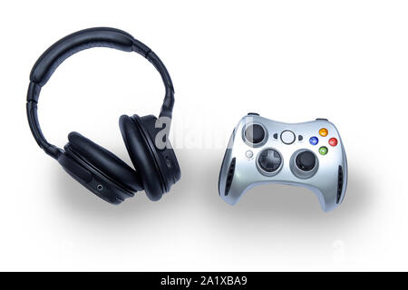 Gamepad and headphones on white background Stock Photo - Alamy