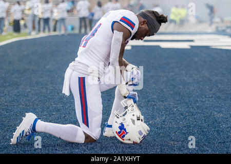 Overtime. 28th Sep, 2019. Louisiana Tech Bulldogs wide receiver Praise Okorie (14) prays prior to an NCAA football game between the Louisiana Tech Bulldogs and the Rice Owls at Rice Stadium in Houston, TX. Louisiana Tech won the game 23 to 20 in overtime.Trask Smith/CSM/Alamy Live News Stock Photo