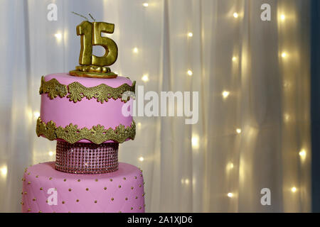 Pink party cake, 15th birthday, with golden number fifteen, pink cake, 15 year old birthday cake Stock Photo