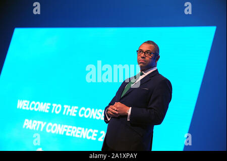 Manchester, England. 29th September, 2019  James Cleverly, Chairman of the Conservative Party delivers his speech to conference, on the first day of the Conservative Party Conference at the Manchester Central Convention Complex.  Kevin Hayes/Alamy Live News Stock Photo