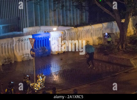 Hong Kong, 28 Sep 2019 - A rioter was throwing a petrol bomb in Hong Kong government house. Stock Photo