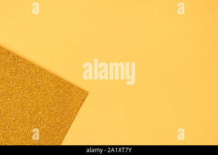 Gold colored glitter paper texture or vintage background Stock Photo - Alamy