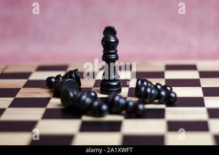 Chess game on a chess board. Wooden chess pieces. Stock Photo