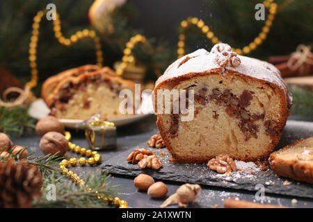 Slice of cake covered cream with Christmas decoration on table, on ...