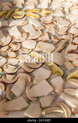 Drying mushrooms on white background, sliced mushrooms Stock Photo