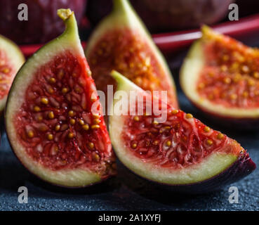 fresh figs close-up photo on black background. dark moody photo Stock Photo