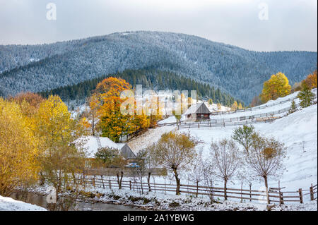 Landscape with first snow and autumn trees in a mountain Stock Photo