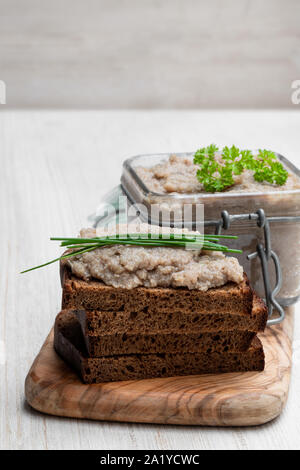 Forshmak  paste from herring with herbs on white wooden table Stock Photo