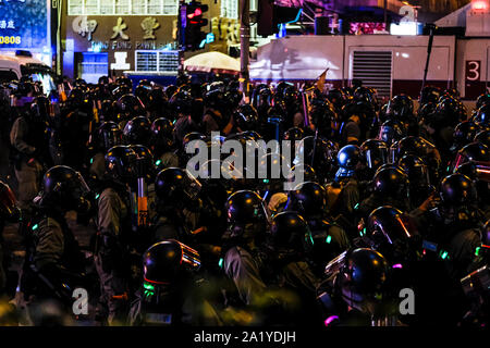 Riot police on guard during the demonstration.Protesters took part in an Anti-Totalitarianism March. Almost four months long protests between Hong Kong people and riot police continue and conflict escalated ahead of the 70th anniversary of communist China's founding. Stock Photo