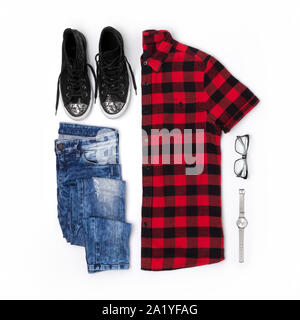 Flat lay Top view female style look with plaid t shirt, jeans, sneakers, watches and glasses Stock Photo
