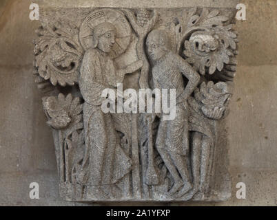 God interrogating Cain depicted in the Romanesque capital dated from the 12th century from the Autun Cathedral (Cathédrale Saint-Lazare d'Autun), now on display in the chapter library of the Autun Cathedral in Autun, Burgundy, France. The capital was probably carved by French Romanesque sculptor Gislebertus. Stock Photo