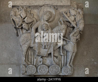 Flight into Egypt depicted in the Romanesque capital dated from the 12th century from the Autun Cathedral (Cathédrale Saint-Lazare d'Autun), now on display in the chapter library of the Autun Cathedral in Autun, Burgundy, France. The capital was probably carved by French Romanesque sculptor Gislebertus. Stock Photo