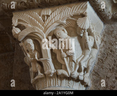 Saint Martin and the Tree depicted in the Romanesque capital dated from the 12th century in the Basilica of Saint Mary Magdalene (Basilique Sainte-Marie-Madeleine de Vézelay) of the Vézelay Abbey (Abbaye Sainte-Marie-Madeleine de Vézelay) in Vézelay, Burgundy, France. Stock Photo