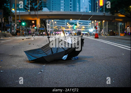 Hong Kong, Hong Kong Sar. 29th Sep, 2019. A discarded umbrella rests in the middle of the street after a violent clash between police and protesters during an anti-government rally in Hong Kong on September 29, 2019. Photo by Thomas Maresca/UPI Credit: UPI/Alamy Live News Stock Photo