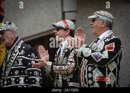 Pearly Kings and Queens, known as Pearlies, are an organised charitable tradition of working class culture in London, England. The practice of wearing clothes decorated with mother-of-pearl buttons is first associated with Henry Croft, an orphan street sweeper who collected money for charity. In the late 1870s, Croft adapted this to create a pearly suit to draw attention to himself and aid his fund-raising activities. Each group of Pearly Kings and Queens is associated with a church in central London and is committed to raising money for charities. (Photo by Laura Chiesa/Pacific Press) Stock Photo