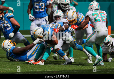 Miami Gardens, Florida, USA. 29th Sep, 2019. Los Angeles Chargers running back Austin Ekeler (30) is taken down by Miami Dolphins defensive back Steven Parker (26) during an NFL football game between Los Angeles Chargers and the Miami Dolphins at the Hard Rock Stadium in Miami Gardens, Florida. Credit: Mario Houben/ZUMA Wire/Alamy Live News Stock Photo