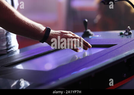 Operator using touch screen to control industrial equipment. Selective focus. Stock Photo