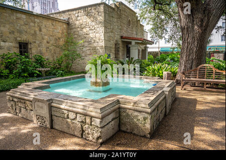 A fountain dedicated to Davy Crockett in the courtyard of The Alamo, San Antonio, Texas. Stock Photo