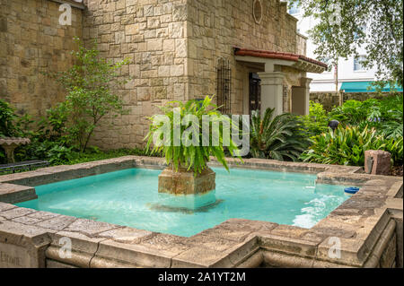 A fountain dedicated to Davy Crockett in the courtyard of The Alamo, San Antonio, Texas. Stock Photo