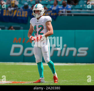 Miami Dolphins running back Patrick Cobbs (38) picks up 30 yards on this  catch against the Baltimore Ravens in first quarter action in the NFL AFC  wildcard game at Dolphin Stadium in