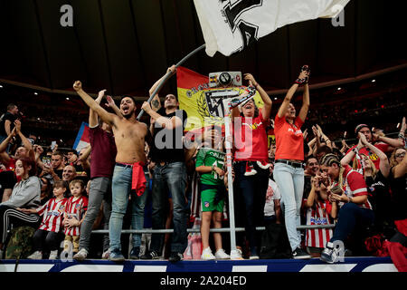 Madrid, Spain. 28th Sep, 2019. Supporters of Atletico de Madrid chant slogans during the La Liga match between Atletico de Madrid and Real Madrid at Wanda Metropolitano Stadium in Madrid.Final score: Atletico de Madrid 0:0 Real Madrid. Credit: SOPA Images Limited/Alamy Live News Stock Photo