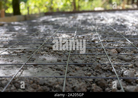 Picture of pouring concrete on a formwork floor at a building site Stock Photo