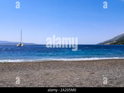 a sailing boat in the adriatic beach of slatni rat Stock Photo