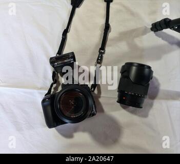 Photographer camera, camera lens and gadgets over white background Stock Photo