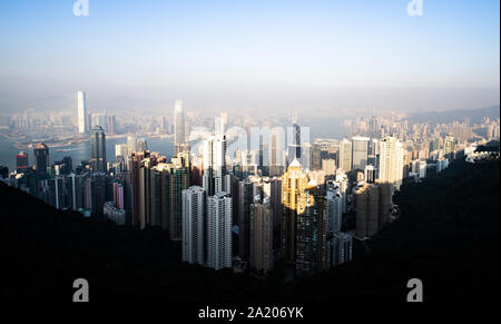 View from above, stunning view of the Hong Kong skyline during a beautiful sunset. Picture taken from the Victoria Peak. Stock Photo