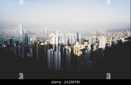 (Filtered picture) View from above, stunning view of the Hong Kong skyline during a beautiful sunset. Picture taken from the Victoria Peak. Stock Photo