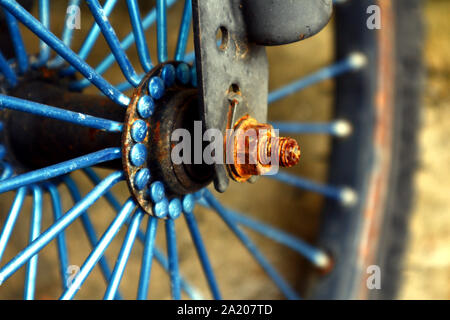 Close up photo of a rusty or corroded nut and bolt of a bicycle wheel Stock Photo
