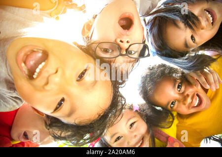 closeup Multi-ethnic group of schoolchildren face Stock Photo