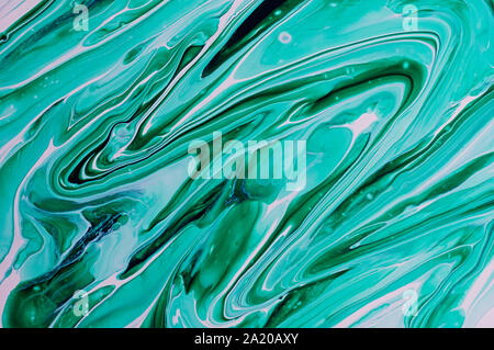 Liquid abstract art. Marble texture of green color. Abstract texture of liquid acrylic. Stock Photo