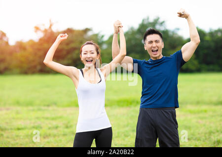 young couple fitness training together outdoors Stock Photo