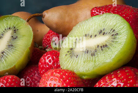 Close up phtography of fresh fruit, kiwi strawberries and pears Stock Photo