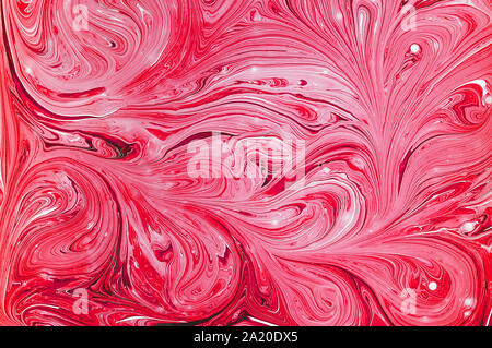Liquid abstract art. Marble texture of red color. Abstract texture of liquid acrylic. Stock Photo