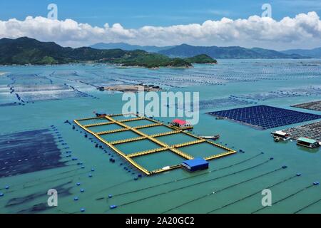 (190930) -- BEIJING, Sept. 30, 2019 (Xinhua) -- Aerial photo taken on July 17, 2019 shows fish breeding raft made of new materials in Xiahu Township of Xiapu County, southeast China's Fujian Province. (Xinhua/Jiang Kehong) Stock Photo