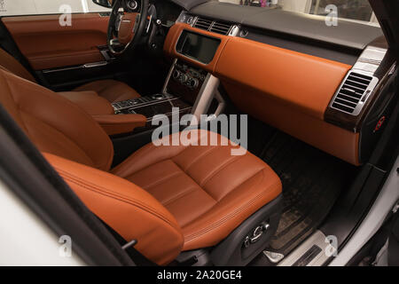 Novosibirsk, Russia - 08.01.2018: Handmade brown and beige leather headrest louis  vuitton for a car in a vehicle interior design workshop against the Stock  Photo - Alamy