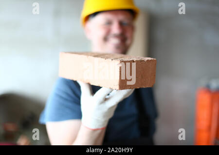 Prudent builder in gloves Stock Photo