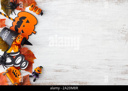 Halloween Pumpkin and Spider decoration on grunge white wooden background.  Flat lay top view with copy space. Stock Photo