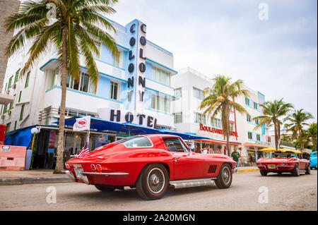 MIAMI - JANUARY 12, 2018: A vintage American automobile parks on Ocean Drive in front of the Colony Hote in South Beach. Stock Photo