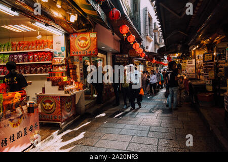 Jiufen, Taiwan - November 07, 2018: People walk with purchases along the Old Street market on November 7, 2018, in Jiufen, Taiwan Stock Photo