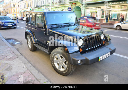 KYIV, UKRAINE - SEPTEMBER 19, 2017: Jeep Wrangler Sahara Black Jeep. Brand of American automobiles that is a division of FCA US LLC, wholly owned subs Stock Photo