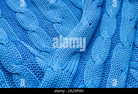 Knitted texture in blue. Background for a holiday card. Close up. Stock Photo
