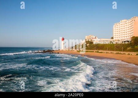 The lighthouse at umhlanga with waves breaking on the shortline Stock Photo