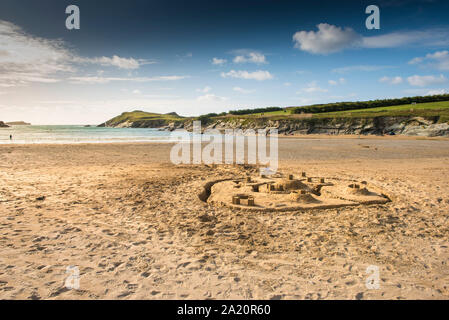 A large sandcastle built on the beach at Porth Beach in Newquay in Cornwall. Stock Photo