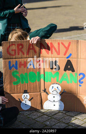 School children preparing a hand painted placard and participating in the Extinction Rebellion climate strike in Truro City City in Cornwall. Stock Photo